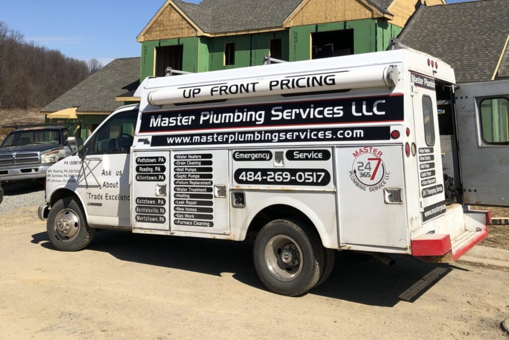 A white truck parked in front of a house.